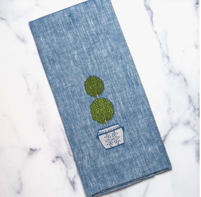 Blue linen towel with boxwood topiary