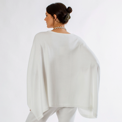 One size fits all poncho with a v-neck and beautiful drape. Looks great over any cami or blouse. A great piece to wear year-round. 