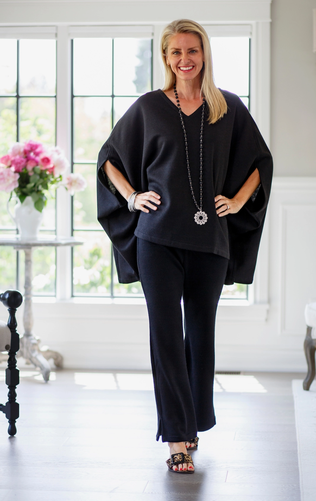 One size fits all poncho with a v-neck and beautiful drape. Looks great over any cami or blouse. A great piece to wear year-round. 
