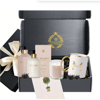 Elegant gift box with L'AVANT hand soap, lotion, candle, and personalized coffee mug, perfect for self-care.