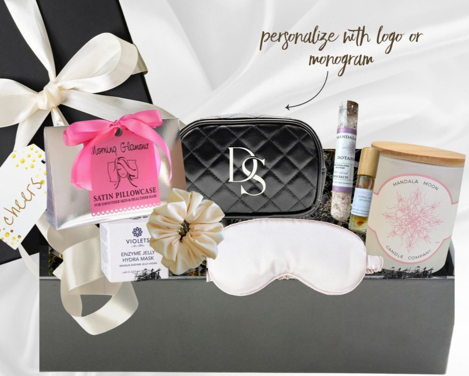 Customized gift box for her featuring silk pillowcase, eye mask, and skincare products, perfect for personalization.