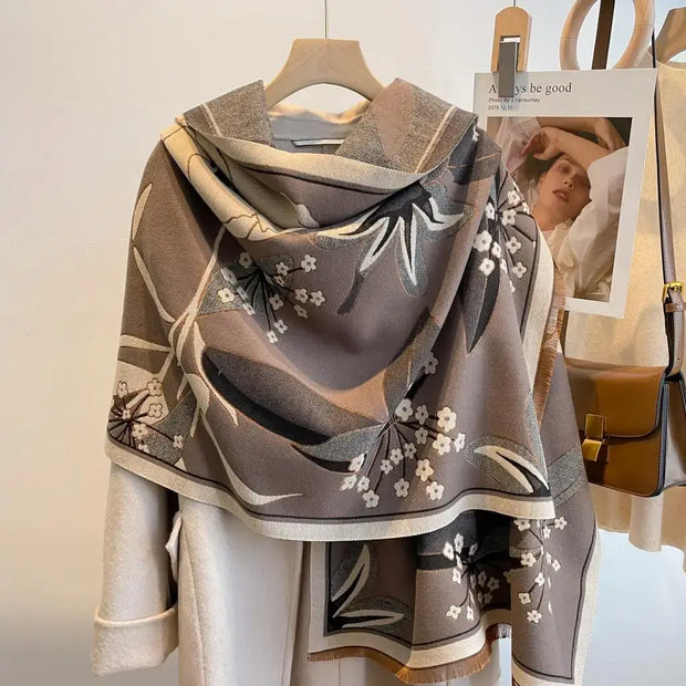 Luxurious reversible tan and gray garden bloom wrap, perfect for elegant layering and versatile fashion.