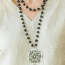 This timeless piece features a long pendant fashioned from beautiful black stone for an elegant touch. Wear it to dress up any look - it pairs flawlessly with jeans or one of our dresses.